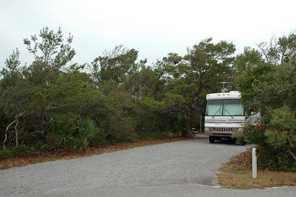 A campsite near the dunes at Henderson Beach State Park