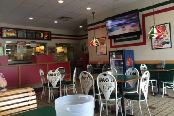 A thin-crust pizza with Provel cheese from Imo’s