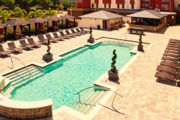 The retro, vibrant pool area at the Hollander Hotel
