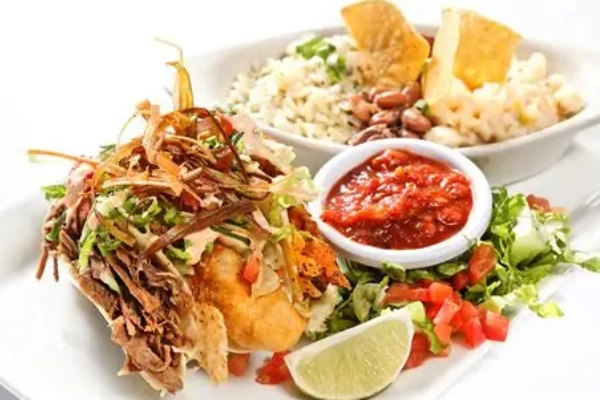 A plate of green chile enchiladas from Camp Robber
