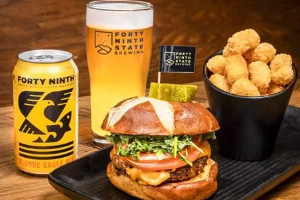 An elk burger and a craft beer at 49th State Brewing Company