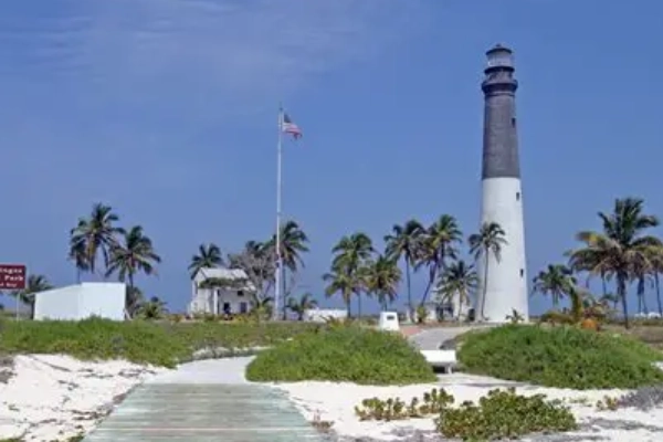 The historic Loggerhead Key Lighthouse standing tall against the sky