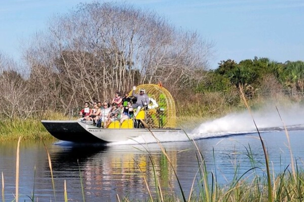 An airboat speeding across the River of Grass outside the national park