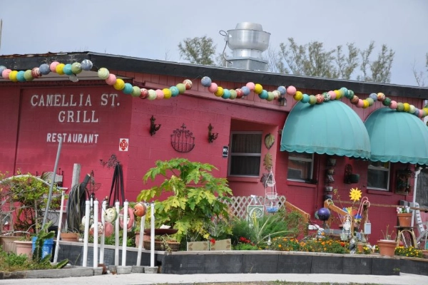 The funky, decorated exterior of the Camellia Street Grill