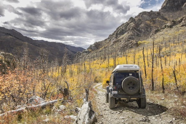 A 4x4 vehicle navigating the sandy Medano Pass Primitive Road