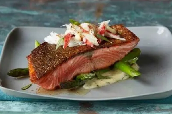 A plate of Alaskan salmon from The Farm Lodge Dining Room