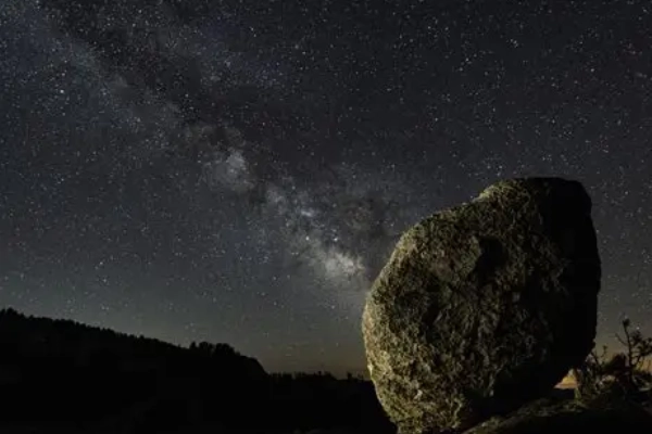 The Milky Way shining brightly in the dark sky over the park