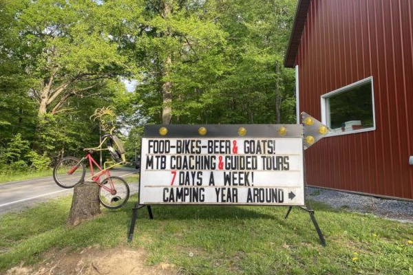 A beer garden with goats at the Arrowhead Bike Farm