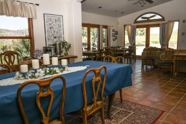 A beautiful inn nestled among vineyards with mountain views