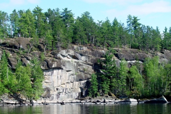 A scenic overlook of a bay with ancient fossil ripple marks visible