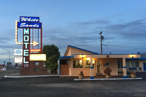 A quirky retro motel with a classic neon sign out front