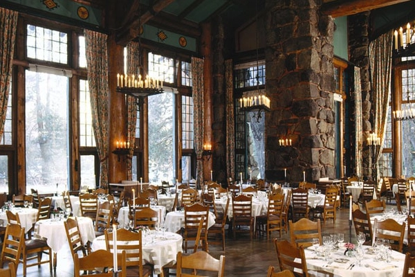 An elegant plate of bison tenderloin served under massive chandeliers