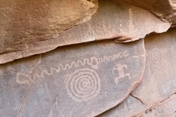 Ancient Paiute carvings on a sandstone wall, proving even ancient folks doodled
