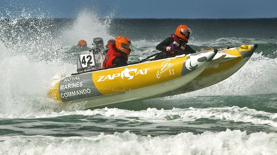 Newquay, Cornwall destination photo: Royal Maribe Zapcat team races through the Newquay surf MOD 45147723